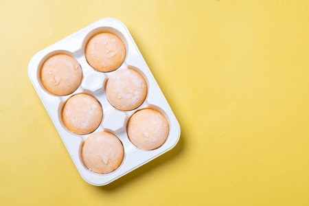 Japanese Mango ice cream mochi on yellow background
