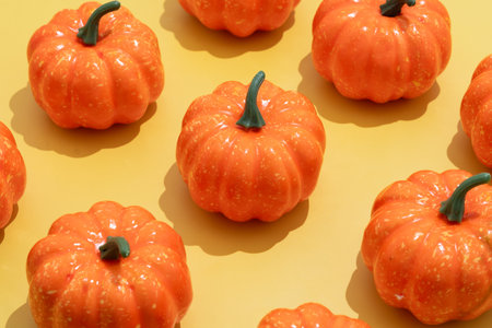 Autumn pumpkins pattern on yellow background