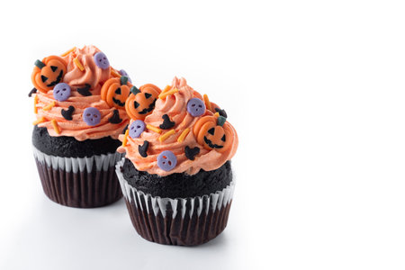 Halloween cupcakes with Halloween sprinkles isolated on white backgroundの写真素材