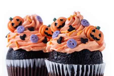 Halloween cupcakes with Halloween sprinkles isolated on white backgroundの写真素材