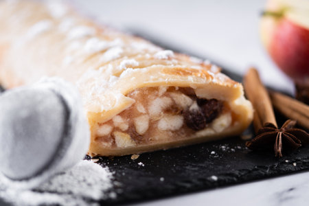 Homemade apple strudel on white marble background. Traditional Austrian and German sweetの写真素材