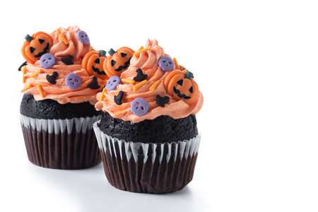 Halloween cupcakes with Halloween sprinkles isolated on white backgroundの写真素材