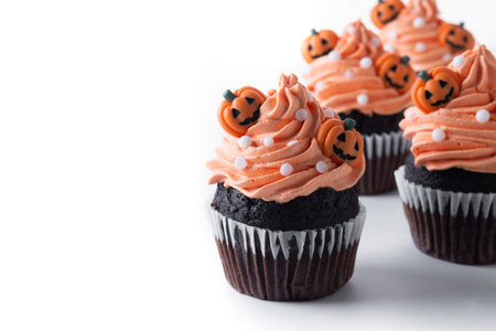 Halloween cupcakes with Halloween sprinkles isolated on white backgroundの写真素材