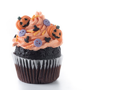 Halloween cupcakes with Halloween sprinkles isolated on white backgroundの写真素材