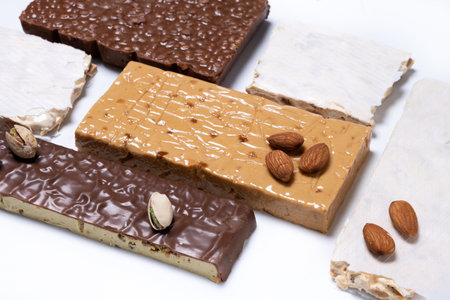 Assorted traditional Christmas nougat isolated on white backgroundの写真素材