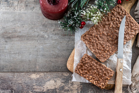 Soft almond nougat bar on wooden tableの写真素材