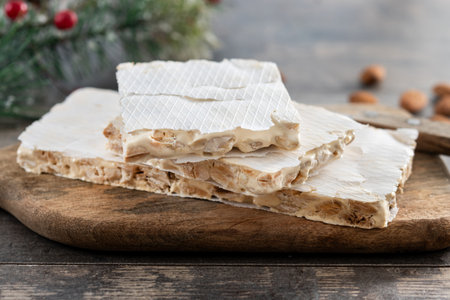 Traditional almond nougat on wooden tableの写真素材