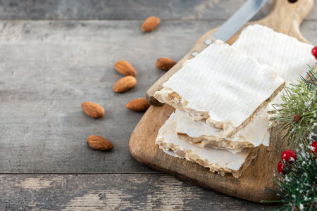 Traditional almond nougat on wooden tableの写真素材