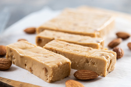 Christmas soft almond nougat bar on wooden tableの写真素材