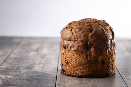Traditional Italian Panettone on wooden table