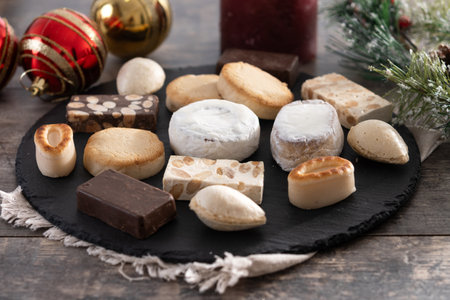Traditional Spanish Christmas sweets assortment on wooden table.の写真素材