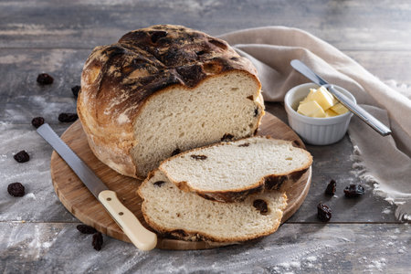 Traditional Irish soda bread with raisins, freshly baked on wooden table