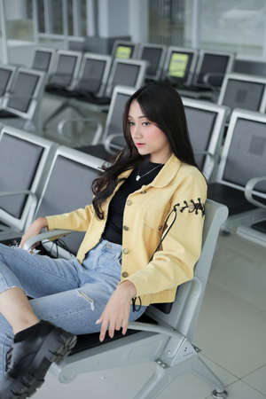 beautiful girl holding hair aloneの写真素材