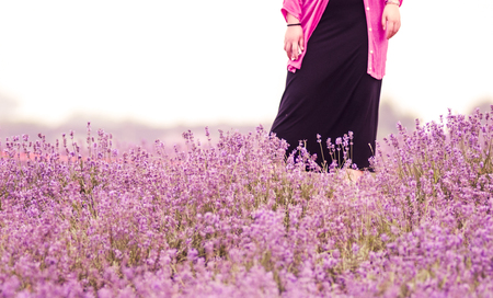 Woman standing in the lavender fieldの写真素材