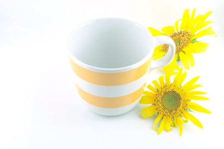 Sunflower and coffee mud and straw hatの写真素材