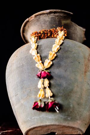 Dried garland flower, thai style isolated on black backgroundの写真素材