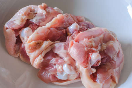 Fresh raw chicken meat on plate on imageの写真素材