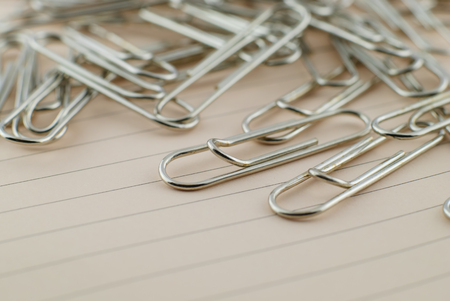 group of paper clip and pink paper imageの写真素材