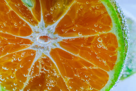 Air bubbles in a liquid. Abstract orange green background. Macroの写真素材