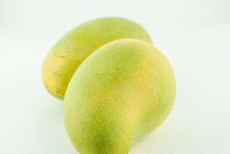 fresh yellow mango isolated on white backgroundの写真素材