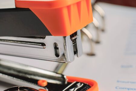 Stapler on white paper business background , office objectの写真素材