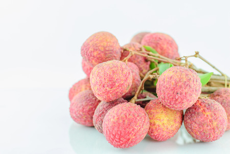 Red Litchi fruit isolated on white backgroundの写真素材