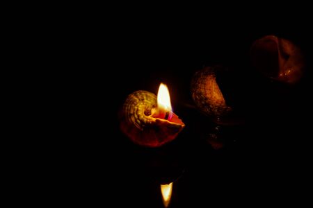 Candle on dark background. Light of candle.の写真素材