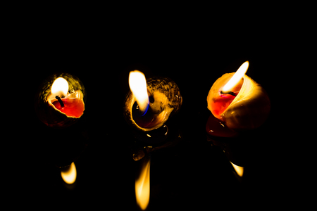 Candle on dark background. Light of candle.の写真素材
