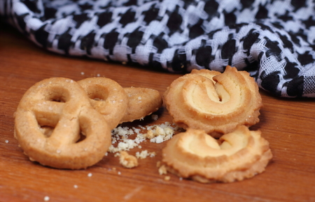 delicious sweet cookies on wooden in background