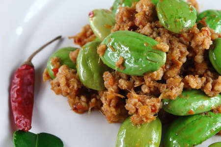 spicy fried pork with stink bean food in thailandの写真素材