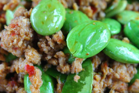 spicy fried pork with stink bean food in thailandの写真素材