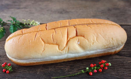 Fresh tasty homemade bread on a wooden