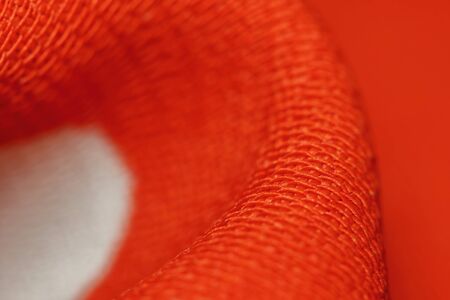 beautiful red color texture of cloth in abstract macro for backgroundの写真素材