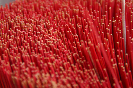 Golden Buddha in Wat temple incense censerの写真素材