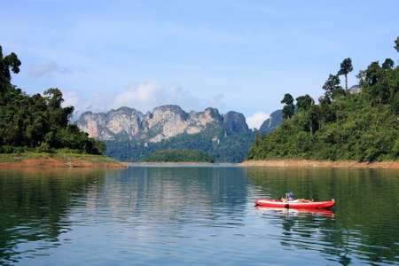 the tourist Read books on Canoe, Chao Lan Dam, Khao Sok National Park, Thailandのeditorial素材