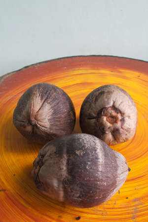 Coconut old on the table.
