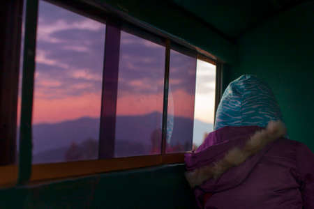 a woman sat quietly by the window of the car,New normal,mind alone