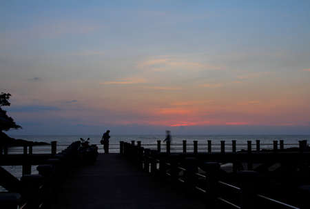 Silhouette evening sunset at port area in thailand,beautiful sea view background