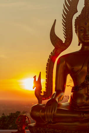 Silhouette of Buddha in a temple,thailandの写真素材