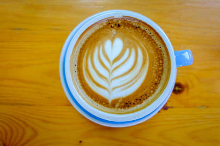 Coffee cup on wooden backgroundの写真素材