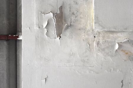 Leakage of rain water on the ceiling tiles and roof damage.の写真素材