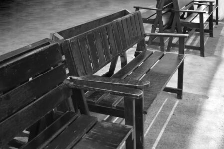 Many wooden chairs and black and white style with text space.の写真素材
