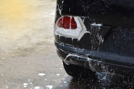 wash the tail lights car black, Bubbles filled the area and empty space for text. の写真素材