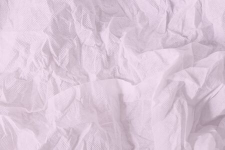 Wrinkled sheet paper white and pink , empty space for text backgroundの写真素材