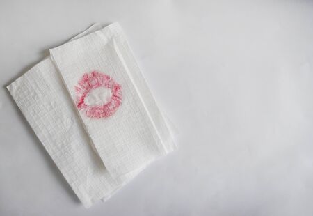 Pink lipstick on napkin white and top table surface of clean for background and empty space for textの写真素材