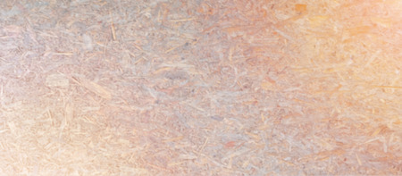 Background blurred top view of compressed light brown wooden texture and empty space for text .