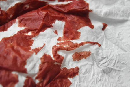 Tissue covered with red blood.の写真素材