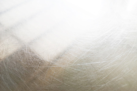 The background sheet metal shine and surface abrasion traces .