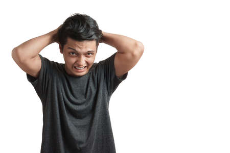 Emotion concept, Young asian man wear white t-shirt angry expression isolate on white background,Copy space with clipping path.の写真素材