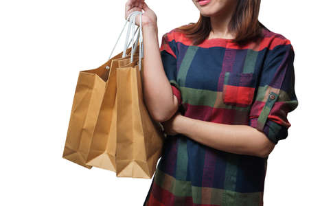 Shopping close up asian woman holding bags, isolated on white background, Copy space with clipping path.の写真素材